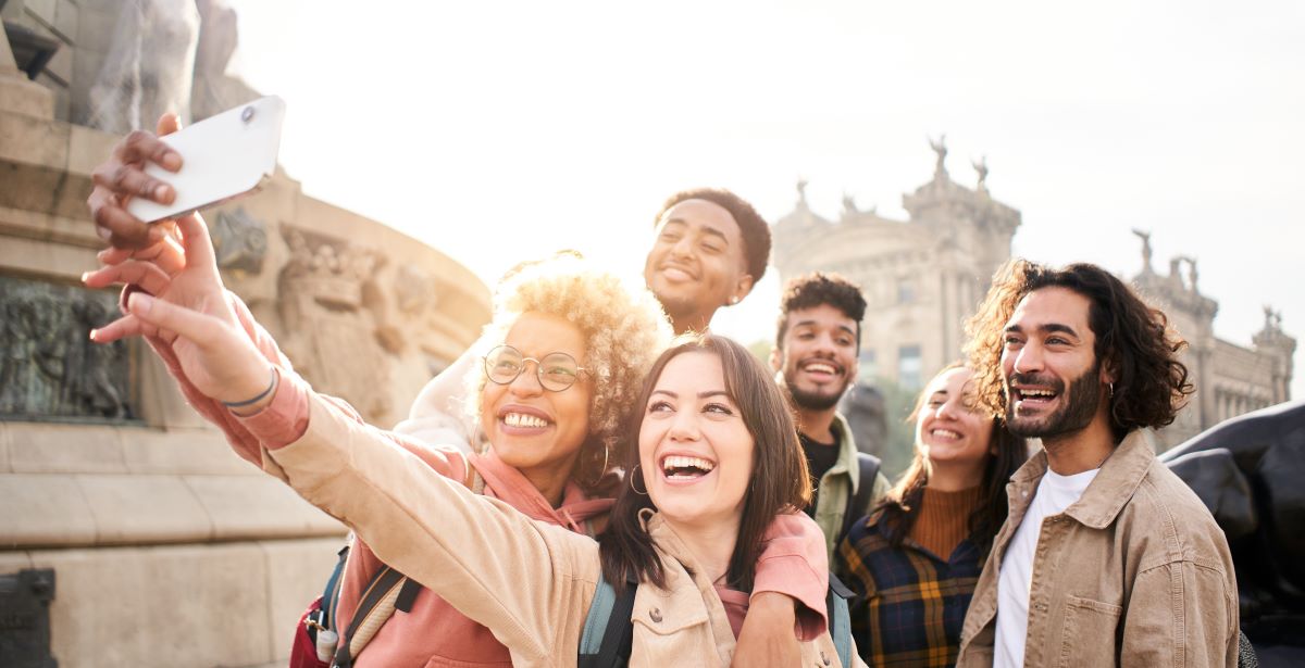 College students traveling abroad taking selfie